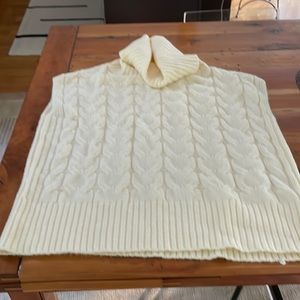 Cream colored sweater vest. Never worn